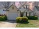 Charming single-Gathering home featuring a well-manicured lawn and attached one car garage at 5120 Silabert Ave, Charlotte, NC 28205