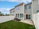 Fenced backyard featuring artificial grass, a patio, and a modern exterior at 665 Cypress Glen Ln, Clover, SC 29710