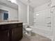 Bathroom featuring granite vanity, toilet, and tiled shower-tub combo with modern fixtures at 665 Cypress Glen Ln, Clover, SC 29710