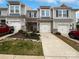 Charming townhome with a stone facade, attached garage, and well-maintained landscaping at 665 Cypress Glen Ln, Clover, SC 29710