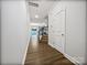 Bright foyer with hardwood flooring, staircase, and open view into the dining and living areas at 665 Cypress Glen Ln, Clover, SC 29710