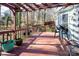 Spacious back deck featuring a pergola overhead, multiple plants, and a stained wood finish at 7007 Chapparall Ln, Charlotte, NC 28215