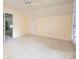Bright bedroom features an open doorway and closet creating a comfortable and inviting atmosphere at 7007 Chapparall Ln, Charlotte, NC 28215