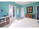 Bright bedroom with ensuite bathroom, featuring modern decor and ample natural light from the doorway at 7007 Chapparall Ln, Charlotte, NC 28215
