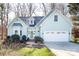 Charming home with a well-manicured lawn, attached garage, and inviting entryway at 7007 Chapparall Ln, Charlotte, NC 28215
