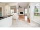 Open-concept kitchen seamlessly flows into the living room, creating an inviting and connected space at 7007 Chapparall Ln, Charlotte, NC 28215