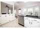 Kitchen featuring a dual sink and stylish cabinetry, offering functionality and charm at 7007 Chapparall Ln, Charlotte, NC 28215