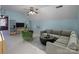 Spacious living room with vaulted ceilings, a ceiling fan, and ample seating at 7007 Chapparall Ln, Charlotte, NC 28215