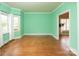 Empty living room with hardwood floors and great natural light at 7007 Chapparall Ln, Charlotte, NC 28215