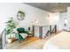 Cozy sitting area in the loft overlooking the main floor with unique decor and natural light at 710 W Trade St # 314, Charlotte, NC 28202