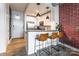 Eat-in kitchen bar with modern lighting and stainless steel appliances at 710 W Trade St # 314, Charlotte, NC 28202