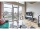 Bright living area with a large window and outdoor balcony at 710 W Trade St # 314, Charlotte, NC 28202