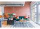 Cozy living room area featuring exposed brick and modern furnishings with balcony views at 710 W Trade St # 314, Charlotte, NC 28202