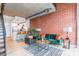 Open floorplan of living room and kitchen featuring exposed brick at 710 W Trade St # 314, Charlotte, NC 28202