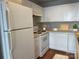Simple white kitchen with modern appliances at 718 W Trade St # 302, Charlotte, NC 28202