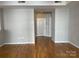 Spacious living room featuring hardwood floors and neutral walls, offering a bright and airy space at 718 W Trade St # 302, Charlotte, NC 28202