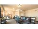 Open living area with modern furniture and adjacent kitchen at 718 W Trade St # 302, Charlotte, NC 28202