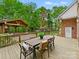 Spacious deck and patio with an outdoor dining area, and adjacent outdoor living area at 7329 Kennington Ct, Charlotte, NC 28270