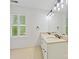 Bathroom features a double sink vanity with granite countertop, plus a bright window view at 7329 Kennington Ct, Charlotte, NC 28270