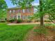 Traditional brick home with manicured landscaping and symmetrical facade offering timeless curb appeal and charm at 7329 Kennington Ct, Charlotte, NC 28270