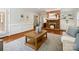 Living room with brick fireplace, built in shelving, and hardwood floors at 7329 Kennington Ct, Charlotte, NC 28270