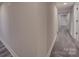 Bright hallway featuring neutral-colored walls and stylish light gray wood-look flooring at 908 Davenport St, Charlotte, NC 28208
