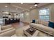 Bright, open-concept living room flows to a modern kitchen with a large island and stylish finishes at 908 Davenport St, Charlotte, NC 28208