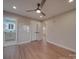 Spacious main bedroom with hardwood floors and ceiling fan at 908 Davenport St, Charlotte, NC 28208