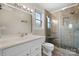 Modern bathroom with tiled shower, glass door, updated sink, and vanity at 9257 Mull Rd, Vale, NC 28168