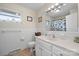 Clean bathroom with tiled walls, a vanity with storage, and a shower-tub combination at 9257 Mull Rd, Vale, NC 28168