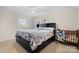 Comfortable bedroom featuring a large bed with storage and a ceiling fan for added comfort at 9257 Mull Rd, Vale, NC 28168