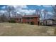 Charming two-story brick home with mature trees and a carport at 9257 Mull Rd, Vale, NC 28168