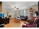 Inviting living room with hardwood floors, a sofa, and a piano at 9257 Mull Rd, Vale, NC 28168