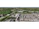 Aerial view of a neighborhood featuring attractive townhomes, mature trees, and a community pool at 9330 Ainslie Downs St, Charlotte, NC 28273