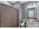 Bathroom featuring a vanity, mirror, shower, and toilet at 9330 Ainslie Downs St, Charlotte, NC 28273