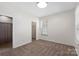 Neutral bedroom featuring a window, carpet, and walk-in closet at 9330 Ainslie Downs St, Charlotte, NC 28273