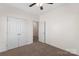 A well-lit bedroom with neutral carpet, double closet, and white trim, ready for personalization at 9330 Ainslie Downs St, Charlotte, NC 28273
