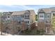 Charming townhome with blue accents, complemented by manicured landscaping and a welcoming front porch at 9330 Ainslie Downs St, Charlotte, NC 28273