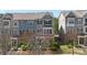 Charming multi-story townhome exterior with a well-maintained lawn and landscaping at 9330 Ainslie Downs St, Charlotte, NC 28273