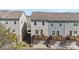 Rear view of townhomes with private balconies and garages, blending outdoor living with practical design at 9330 Ainslie Downs St, Charlotte, NC 28273