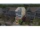 Aerial view highlighting the charming townhome's exterior and surrounding landscaped grounds at 9330 Ainslie Downs St, Charlotte, NC 28273