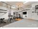 A home gym in garage featuring ample space and equipment for a complete workout at 9330 Ainslie Downs St, Charlotte, NC 28273