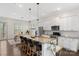Open kitchen features a large island, modern appliances, and seamless flow into the dining area at 9330 Ainslie Downs St, Charlotte, NC 28273