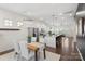 Open-concept kitchen seamlessly flows into the dining area, featuring a large island at 9330 Ainslie Downs St, Charlotte, NC 28273