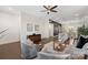 Open-concept living space with modern furnishings, hardwood floors, and ample natural light at 9330 Ainslie Downs St, Charlotte, NC 28273