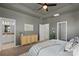 Cozy main bedroom with tray ceilings features natural lighting and access to the main bathroom at 9330 Ainslie Downs St, Charlotte, NC 28273