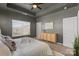 Comfortable main bedroom with tray ceilings features neutral decor and ample storage space at 9330 Ainslie Downs St, Charlotte, NC 28273