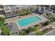 A sparkling community pool is surrounded by lounge seating and lush greenery, creating a relaxing oasis at 9330 Ainslie Downs St, Charlotte, NC 28273