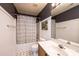 This bathroom features a shower/tub, toilet, patterned floor tiles, and a wood vanity at 102 Brewster Ct, Mooresville, NC 28115