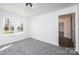 Comfortable bedroom with gray carpet and natural light from double windows at 102 Brewster Ct, Mooresville, NC 28115